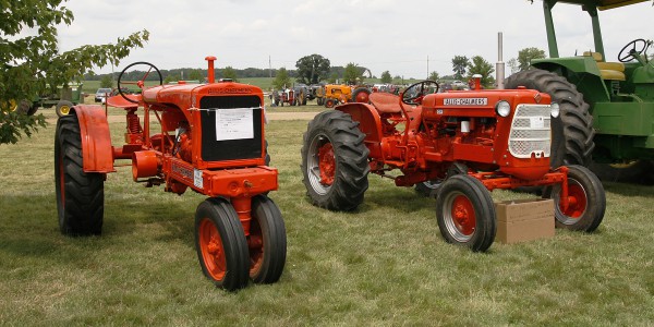 A pair of vintage Allis - Chalmers tractors.